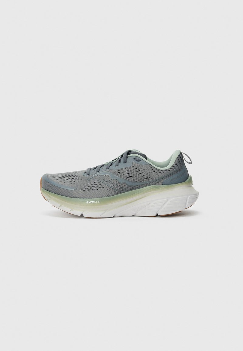 Lightweight running shoe in grey mesh with green accents. Notable thick white sole with textured grip and logo detail. Minimalist design.