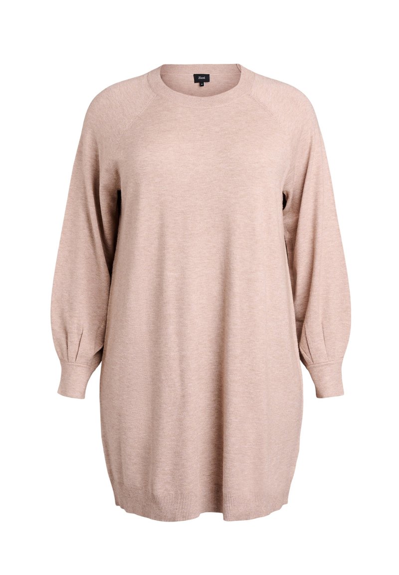 Jasnoprawy, oversize sweter z raglanowymi rękawami, prążkowanymi mankietami i dołem oraz okrągłym dekoltem, wykonany z miękkiego dzianinowego materiału.