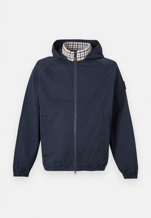 Giacca con cappuccio blu navy con zip frontale, polsini ed orlo elasticizzati, tasche laterali e fodera interna del colletto a quadri beige.