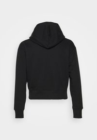 Svart kortärmad hoodie med texturerat tyg, med en stor huva, långa ärmar och ribbade muddar och nederkant. Enkel, minimalistisk design.