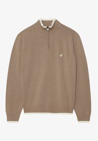 Brun stickad tröja med vita accenter, halvlång dragkedja i kragen och en liten logga på bröstet. Mjuk textur och åtsittande ärmar.