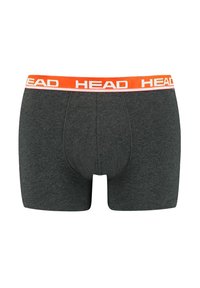 Männer Boxer Shorts aus dunkelgrauem Stoff mit einem orangefarbenen Elastikbund, auf dem der Markenname "HEAD" in weißer Schrift steht.
