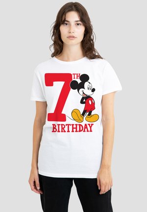 White cotton t-shirt featuring a large red "7TH" and "BIRTHDAY" text, with a cartoon Mickey Mouse in red shorts and yellow shoes.