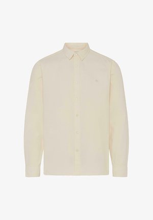 Osvetljen bež dolg rokav s gumbi, narejen iz bombaža, z usnjeno ovratnico in majhnim veznim logotipom na levem prsnem delu.