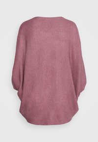 Stickad batwingtröja i en mjuk mauvefärg. Har en lös passform och ribbad struktur. Slät, lättviktig tyg med vida ärmar.