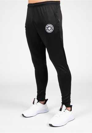 VERNON - Tracksuit bottoms - black