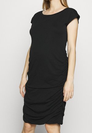 Zwarte zwangerschapsjurk van zachte stof, met een ronde hals, korte mouwen en geplooide details aan de zijkanten voor een aansluitende pasvorm.