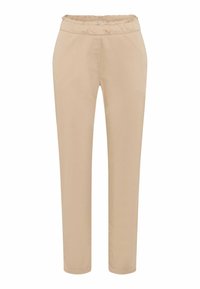 Pantalon beige à taille élastique avec une texture lisse, présentant une coupe ajustée et une jambe fuselée, des détails cousus et sans poches visibles.