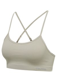 Ljusgrå sportbh med ribbad textur, med korslagda axelremmar och en logotyp på bandet. Slen, elastisk tyg för komfort.
