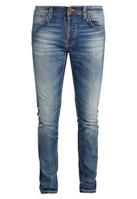 Slim fit blå denimjeans med en blekt tvätt, fem fickor, bältesslingor och en kopparknappsstängning. Strukturerad tyg med synliga sömmar.