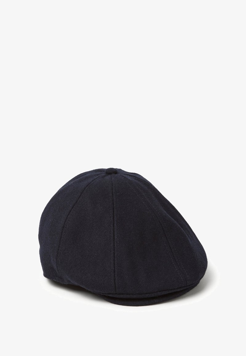 Gorra de lana color navy estilo boina con forma redondeada, secciones cosidas y un pequeño botón en la parte superior. Textura suave, visera curvada en la parte frontal.