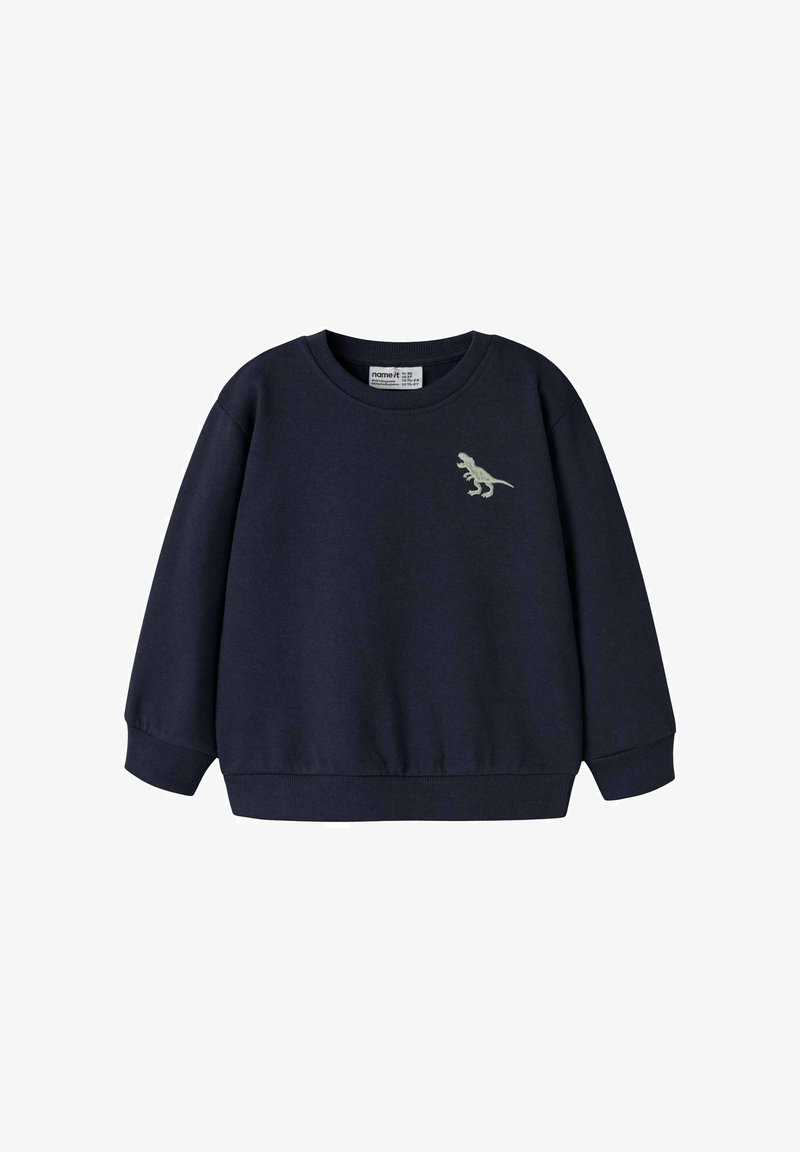 Sweat-shirt bleu marine à manches longues, col rond, poignets côtelés, et un motif de dinosaure brodé sur le côté gauche de la poitrine. Matière douce.