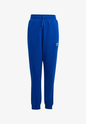 Pantalones deportivos azules de Adidas con cintura elástica, cordón ajustable, bolsillos laterales, tobillos con puño y pequeño logo blanco de Adidas en el muslo izquierdo.