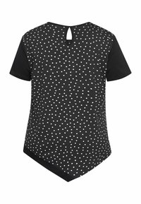 T-shirt nera con pois bianchi, maniche corte e design a chiave sulla schiena. Presenta un orlo arrotondato e una texture liscia.