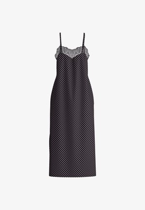Zwarte jurk met stippen, voorzien van een met kant afgewerkte halslijn, verstelbare bandjes en een getailleerde snit, die net boven de knie eindigt.