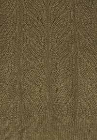 Knitted sweater in olive green with textured pattern featuring leaf motifs, ribbed hem, and a soft wool-like appearance.
