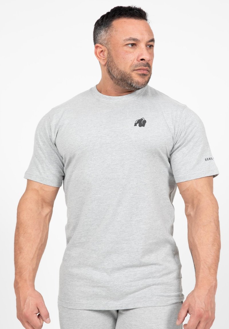 Grijze t-shirt met korte mouwen van een katoenmix, met een zwart gorilla-logo op de linkerborst en subtiele branding op de mouw.