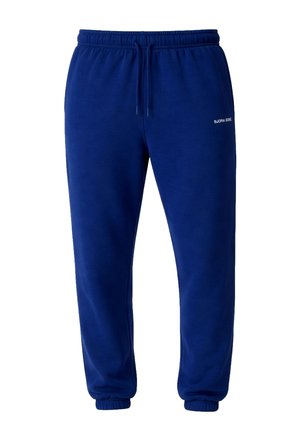 Niebieskie spodnie dresowe z polaru z elastycznym pasem i ściągaczami, bocznymi kieszeniami oraz małym białym napisem "Bjorn Borg" na prawej udzie.