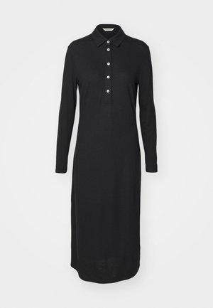 Abito polo lungo nero con maniche, colletto, patta con quattro bottoni e vestibilità dritta, realizzato in un tessuto liscio e leggero.