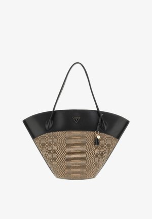 Grand sac fourre-tout à motifs noirs et beige avec longues anses, bordure noire et petit pendentif décoratif suspendu.