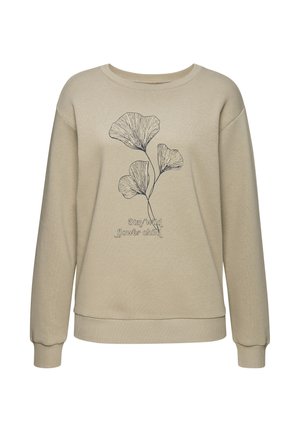 Beige sweatshirt met lange mouwen, een bloemrijke lijntekening en de tekst "Stay wild flower child" op de voorkant.