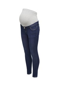 Tummansiniset äitiysfarkut joustavalla harmaalla vyötärönauhalla, joka on suunniteltu mukavasti sopimaan raskaana olevan vatsan ympärille.