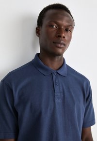 BOSS DYE - Polo majica - open blue