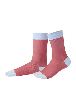 Pair of red socks with thin white vertical stripes, white toe, heel, and cuff areas, shown against a plain white background.