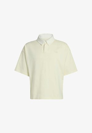 Polo de manga corta en amarillo claro. Confeccionado en algodón suave, presenta un cuello clásico, tapeta de botones y un bordado sutil del logo en el pecho.
