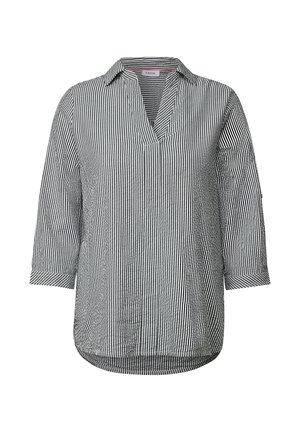 Randig blus i svart och vitt, med v-ringning, trekvartslånga ärmar och en något rundad nederkant. Tillverkad av lättviktsmaterial.