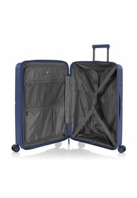 Valigia rigida blu navy con un interno a due scomparti. Dispone di tasche con zip, cinghie elastiche e ruote fluide per una facile mobilità.
