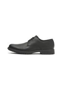 Scarpa da uomo in pelle nera con punta tondeggiante, lacci, superficie texture e suola in gomma con piccole scanalature per la trazione.