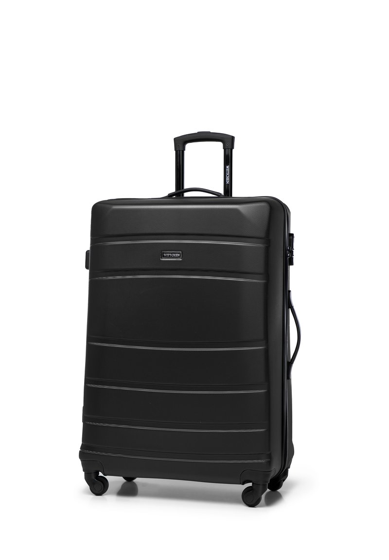 Schwarze Hartschalen-Reisetasche mit erhöhten horizontalen Linien, ausziehbarem Griff, vier leichtläufigen Rädern und einem Seitentragegriff.