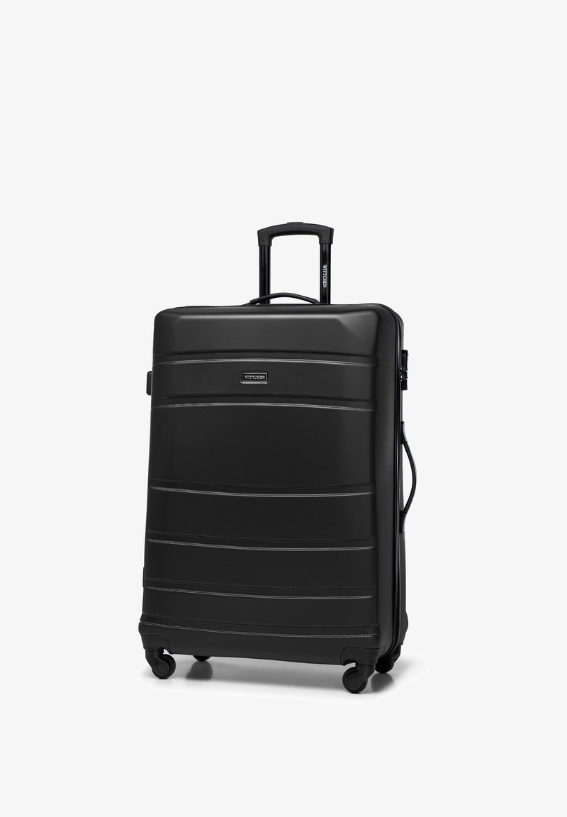 Schwarze Hartschalen-Reisetasche mit erhöhten horizontalen Linien, ausziehbarem Griff, vier leichtläufigen Rädern und einem Seitentragegriff.