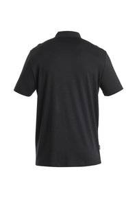 Zwarte polo van een katoenmix, met een klassieke kraag en korte mouwen. Glad textuur met een label aan de achterkant bij de zoom.