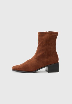 Brown suede ankle boot with a square toe and low block heel, side zipper closure, shown in profile on a white background.