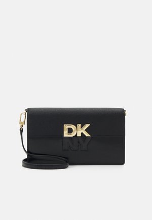 Black leather crossbody bag with gold hardware, featuring embossed "DK NY" logo. Smooth texture, rectangular shape, adjustable strap.