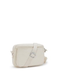 Beżowa torebka typu crossbody wykonana z gładkiego materiału, charakteryzująca się prostokątnym kształtem, regulowanym paskiem oraz zapięciem na zamek z pluszowym akcentem.