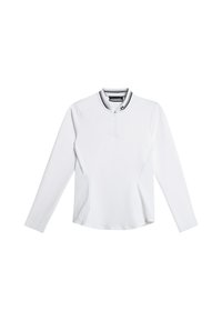 Haut blanc à manches longues avec un col zippé, doté d'un col rayé noir et blanc et d'une coupe ajustée et fluide.