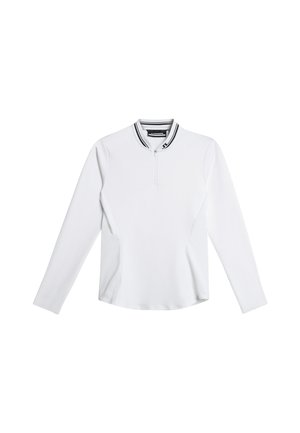 Valkoinen pitkähihainen paita vetoketjullisella kauluksella, jossa mustavalkoraidallinen kaula-aukko ja sileä, istuva muotoilu.