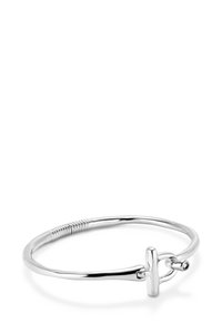 Bracelet en argent avec une forme lisse et arrondie, équipé d'un fermoir à bascule et d'une section avec texture enroulée pour plus de détail.