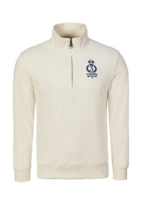 Sudadera crema con cremallera y cuello alto, puños y cintura acanalados. Presenta un logo azul marino con una corona y el número "3".