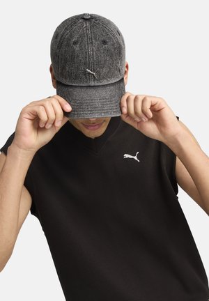 Gray textured cap with rounded brim, featuring a logo on the front. Black sleeveless top with a small logo on the chest.
