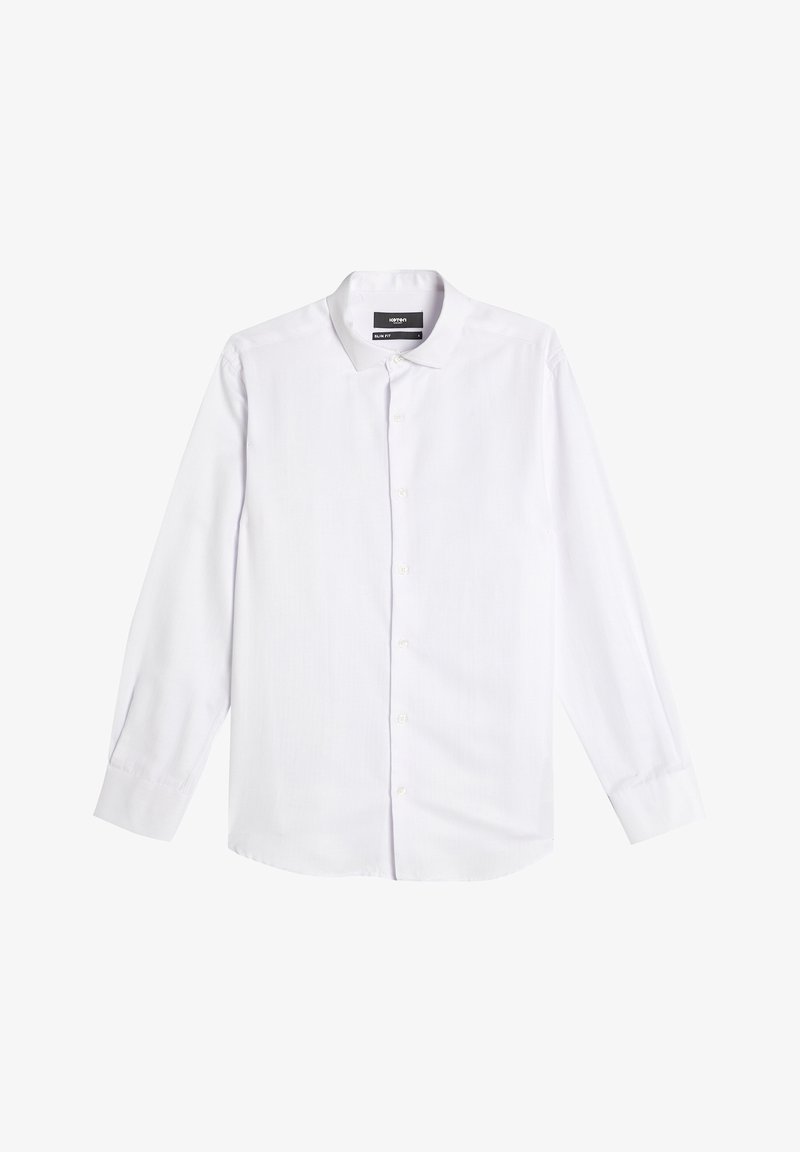 Valkoinen pitkähihaista paitaa slim fit -mallissa. Siinä on klassinen kaulus, nappi-etuosa ja sileä, teksturoitu kangas. Napit on sijoitettu tasaisesti.