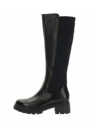 Bota alta de cuero negro con panel trasero elástico, suela gruesa con dibujo y tacón cuadrado diseñada para la moda y la durabilidad.