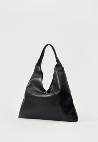 Black leather shoulder bag with a triangular shape, braided handle, and a front pocket. Smooth texture and minimalistic design.