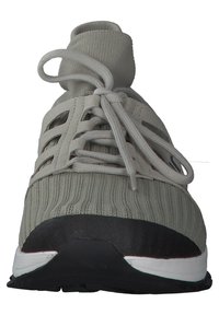 Gray athletic shoe with ribbed upper, lace closure, padded collar, and black rubber sole. Features a low-profile design and contrast accents.