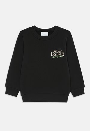 Black sweatshirt with ribbed crew neck and cuffs. Features embroidered text "EST. 2011" and "LES DEUX" in gold and green. Plain texture.