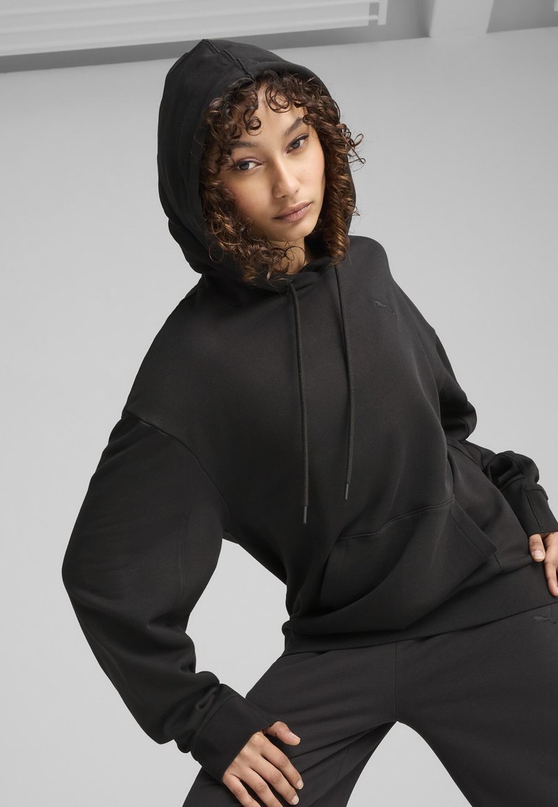 Puma RELAXED FIT Jersey con capucha black/negro