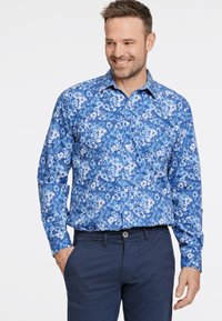 Blaues Blumenshirt mit Knöpfen in verschiedenen Blautönen, ausgestattet mit einem verbreiterten Kragen, langen Ärmeln und einem schlanken Schnitt.
